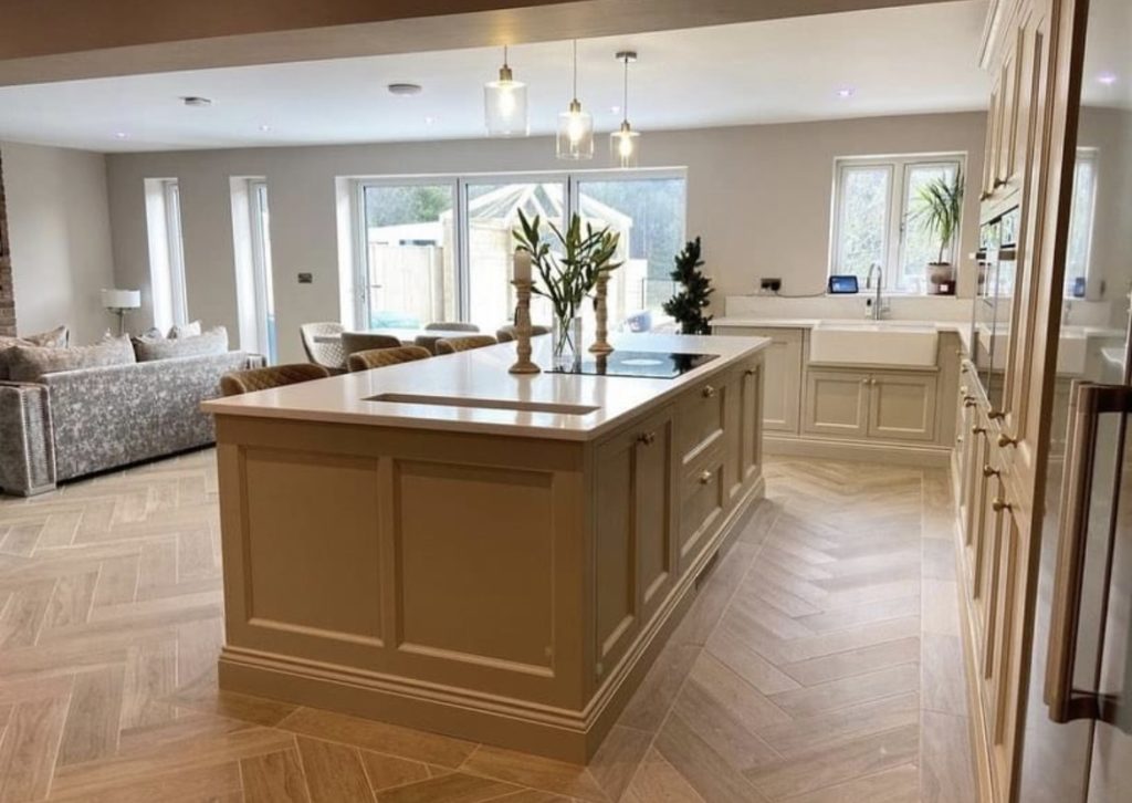 Bespoke kitchen in Mansfield with custom cabinetry, a statement island, and modern lighting